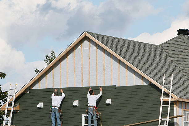 Professional Siding technician working in Elon, NC